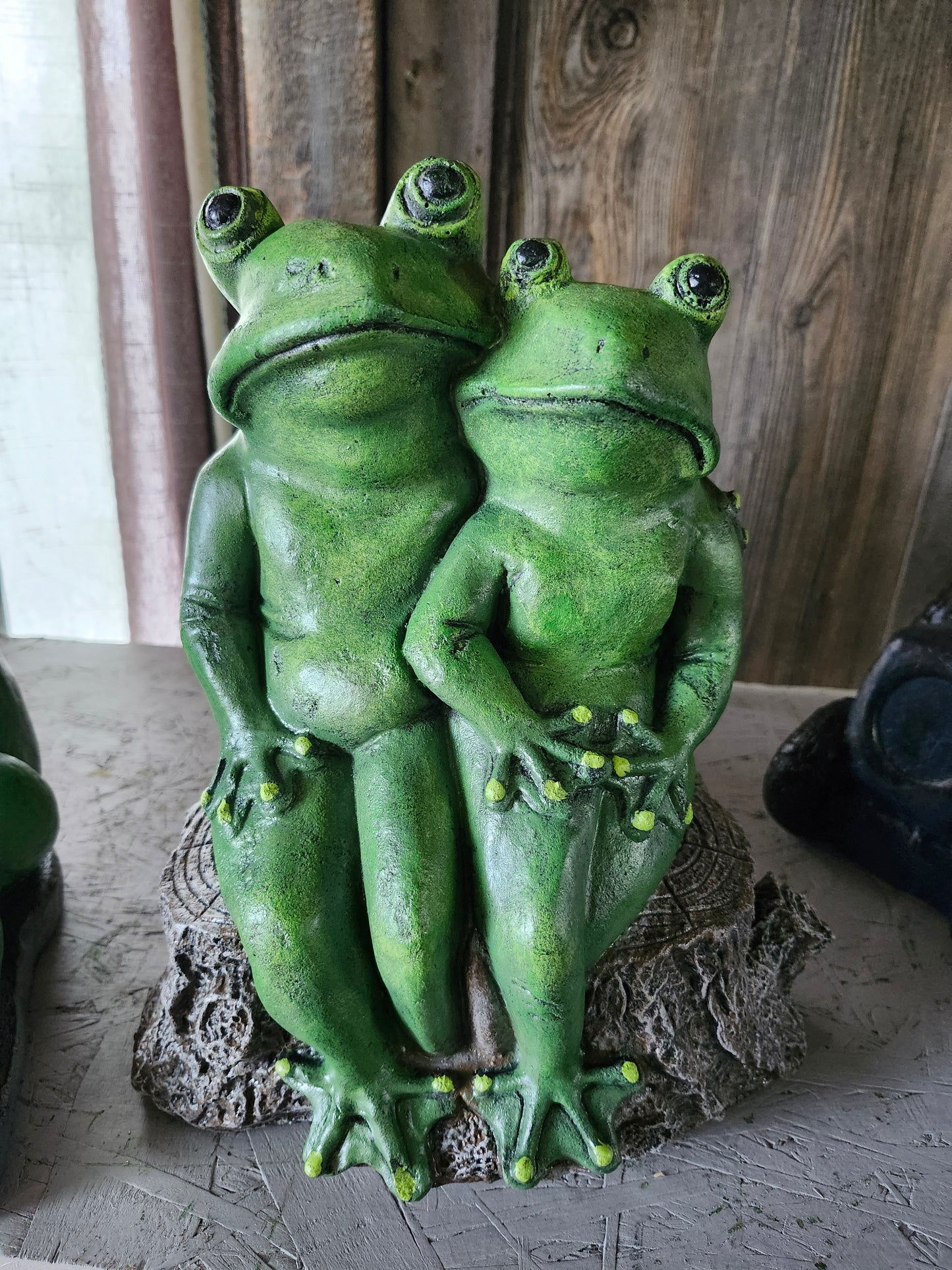 Frogs sitting on stump