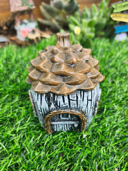 Pinecone fairy house