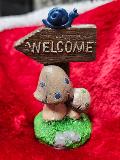 Welcome mushroom sign with snail